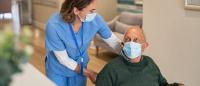 Nurse helping nursing home resident